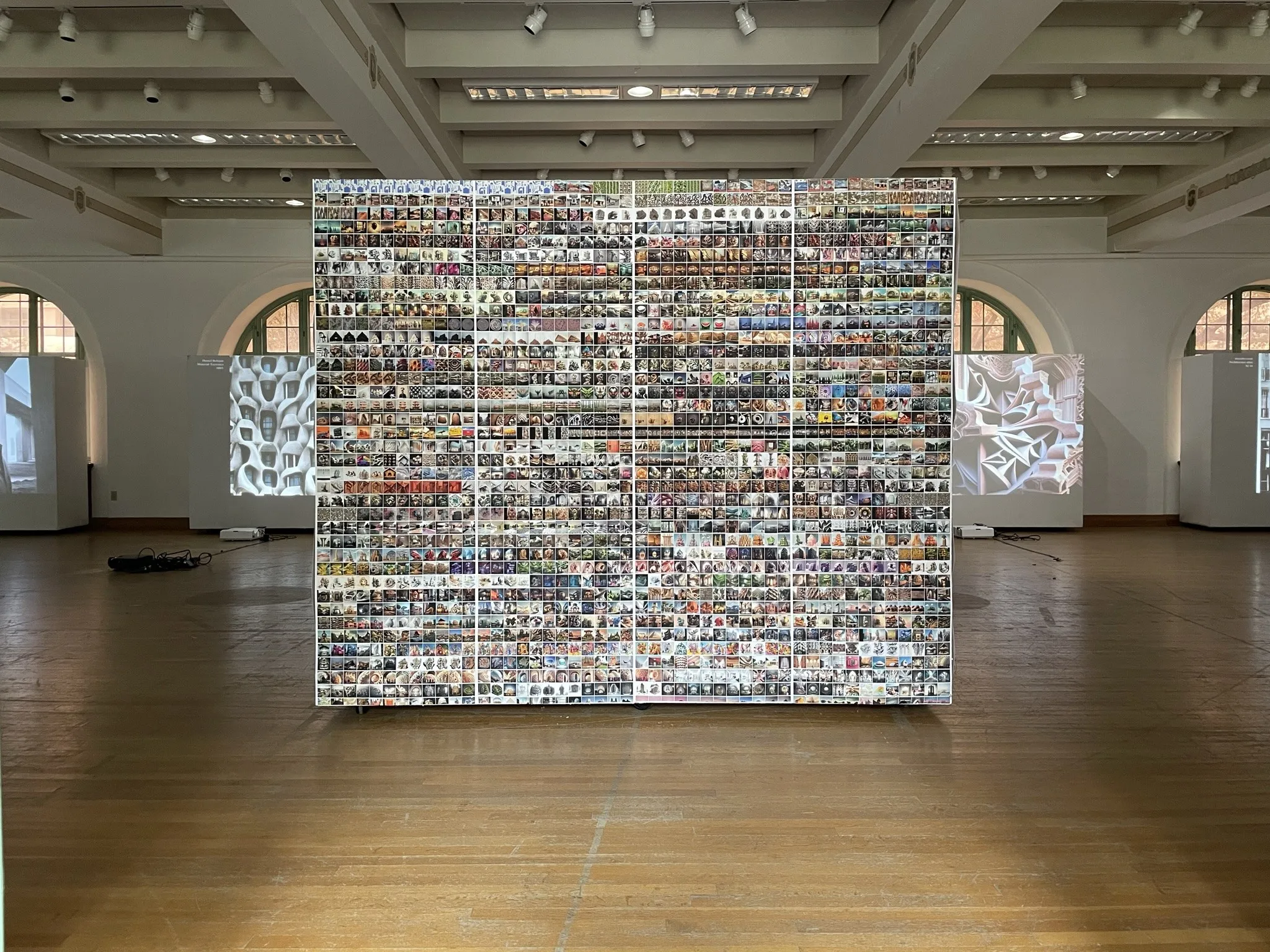 The projected wall of works during the opening