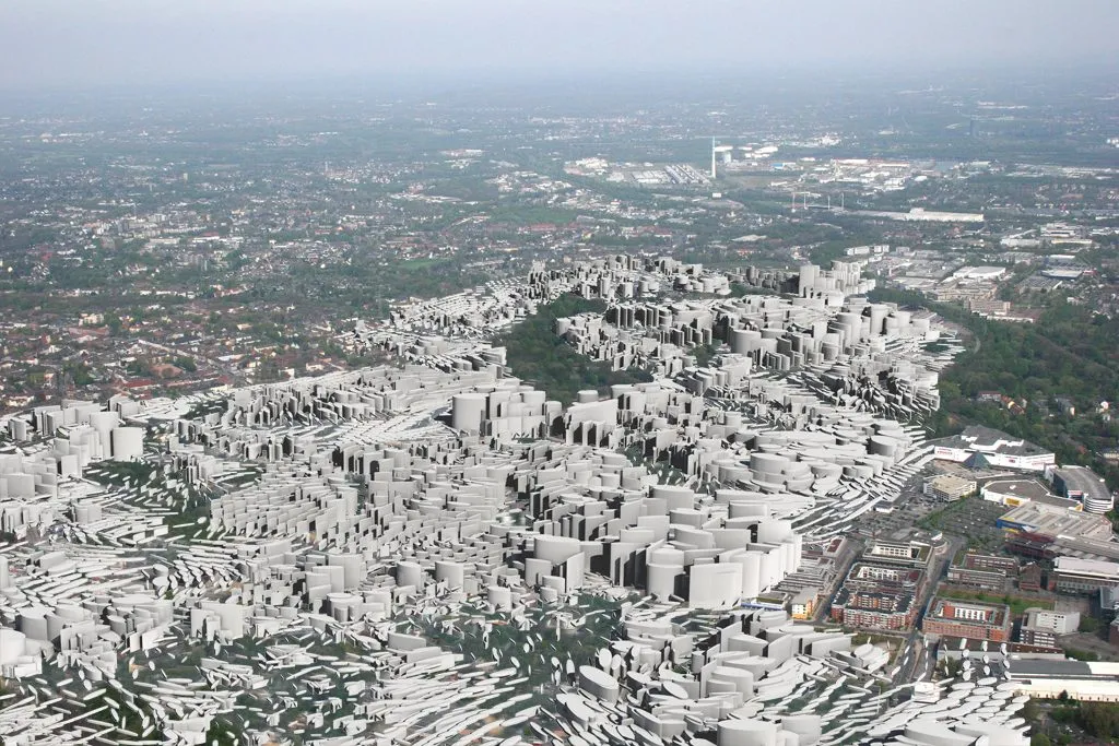 Aerial photograph of Essen with the new configuration of the Krupp belt set in as a white relief among the existing blocks