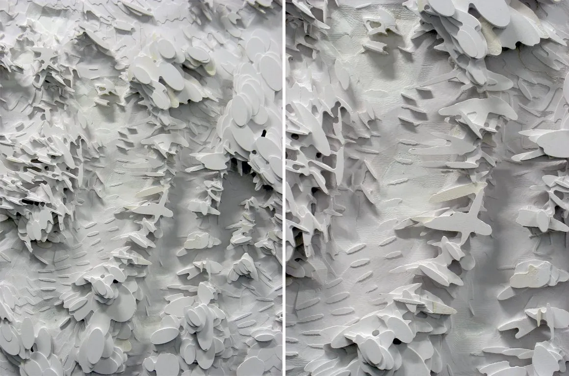 Close photograph of a white relief model of the site, its surface ridged like a dune field