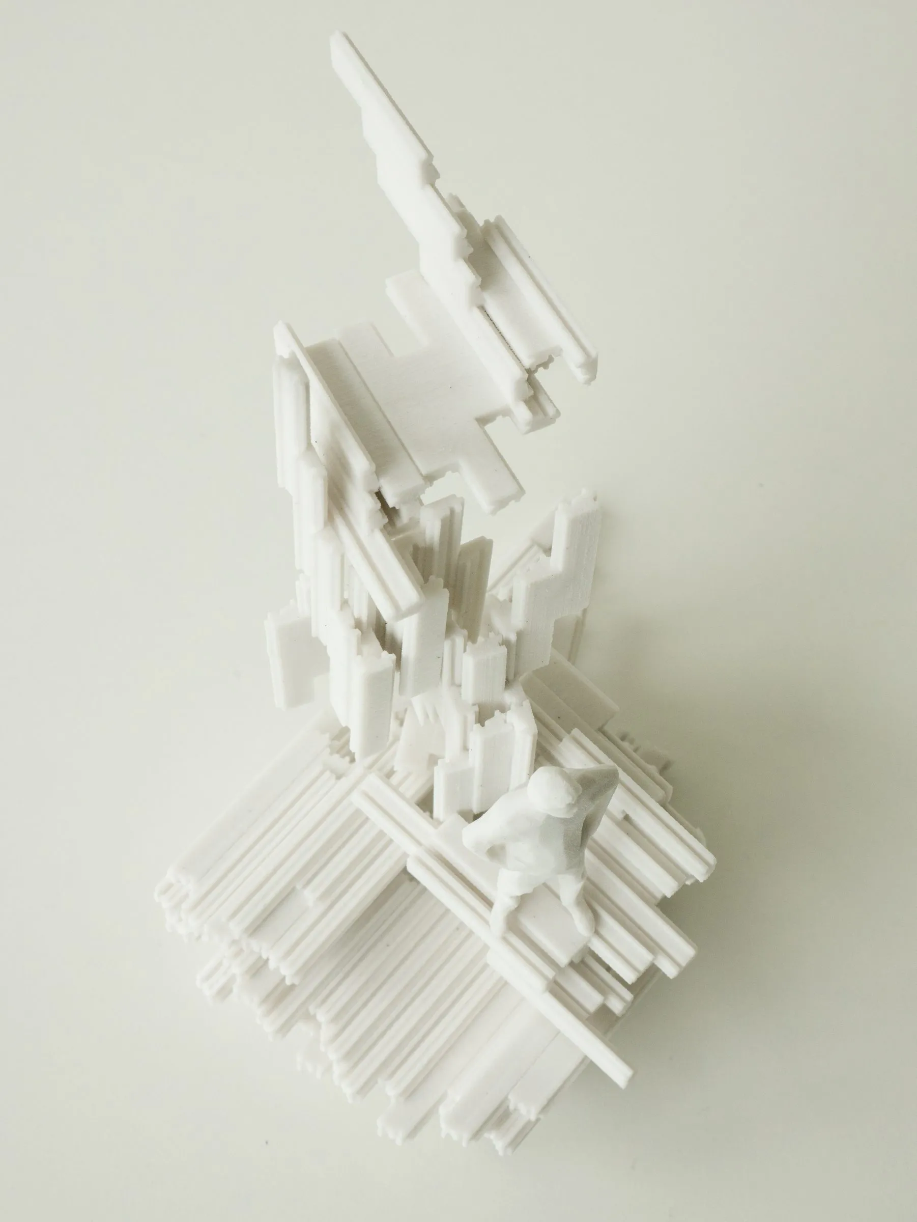 The white model seen from above: frames radiating from the core over a wide base