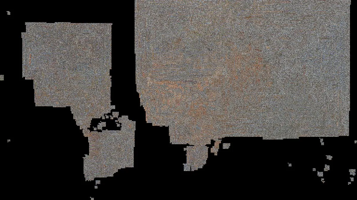A black field with a large irregular region of tiny images: the dataset sorted in embedding space