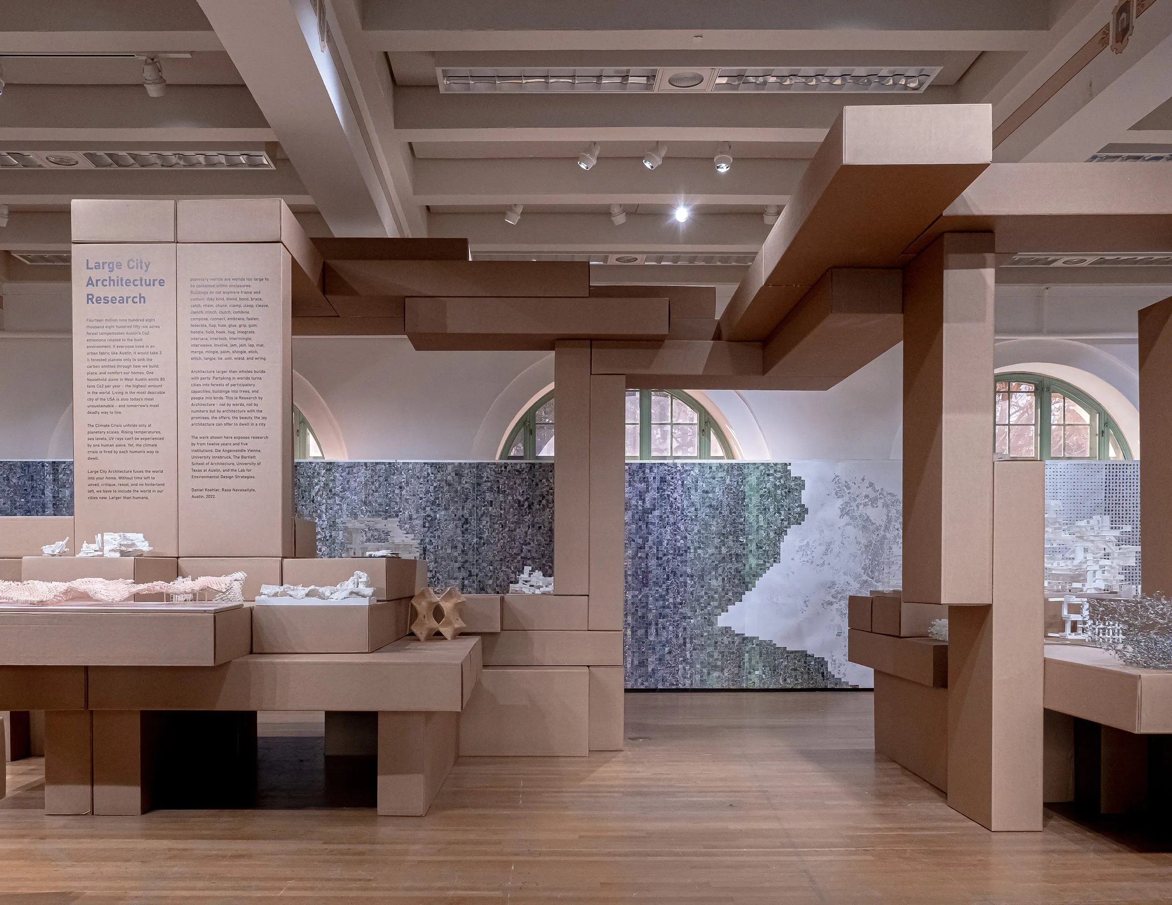 The gallery with its printed wall and the plinths of models