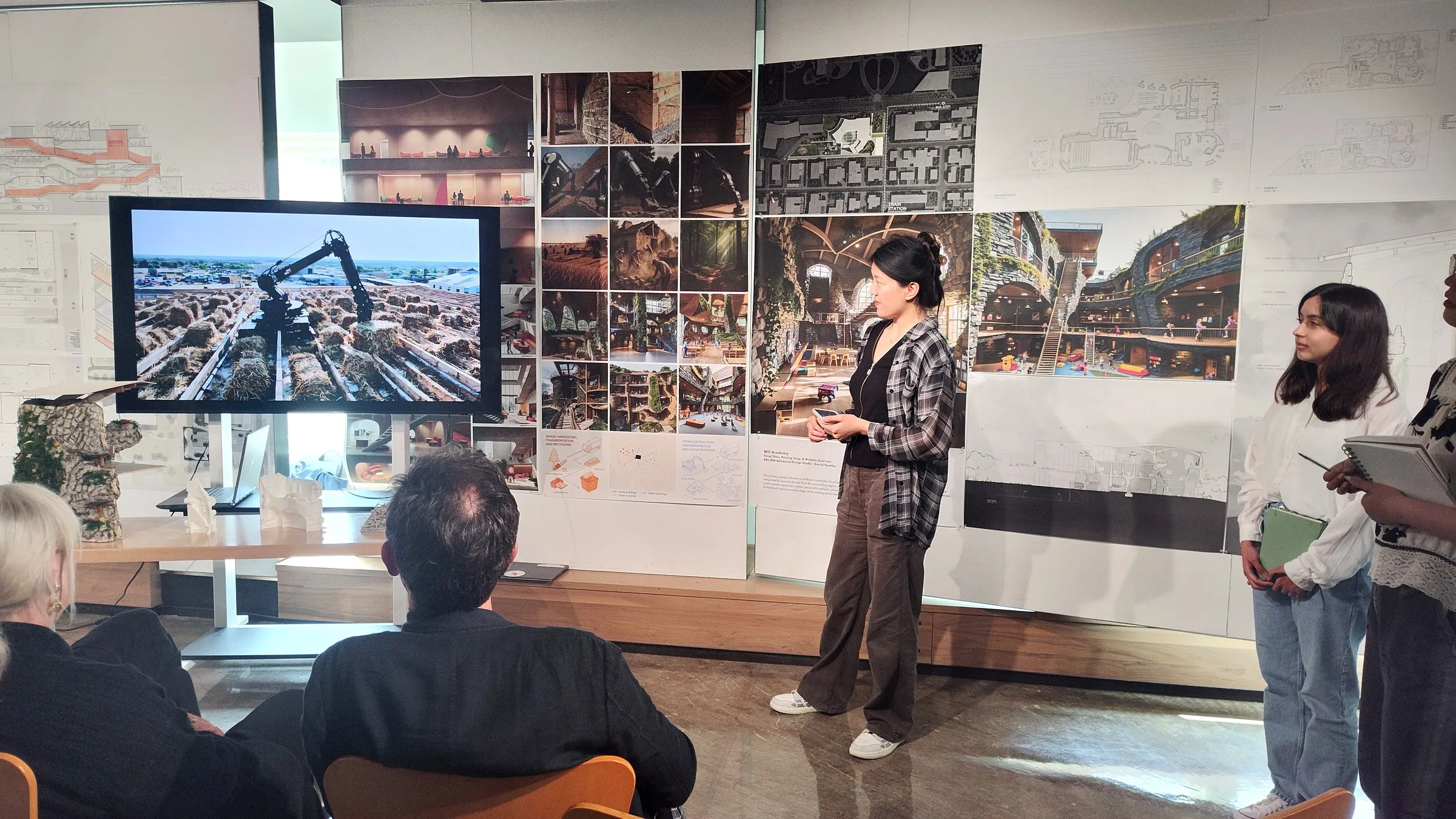 Final review of the Meta-Learning studio with models and drawings on the wall