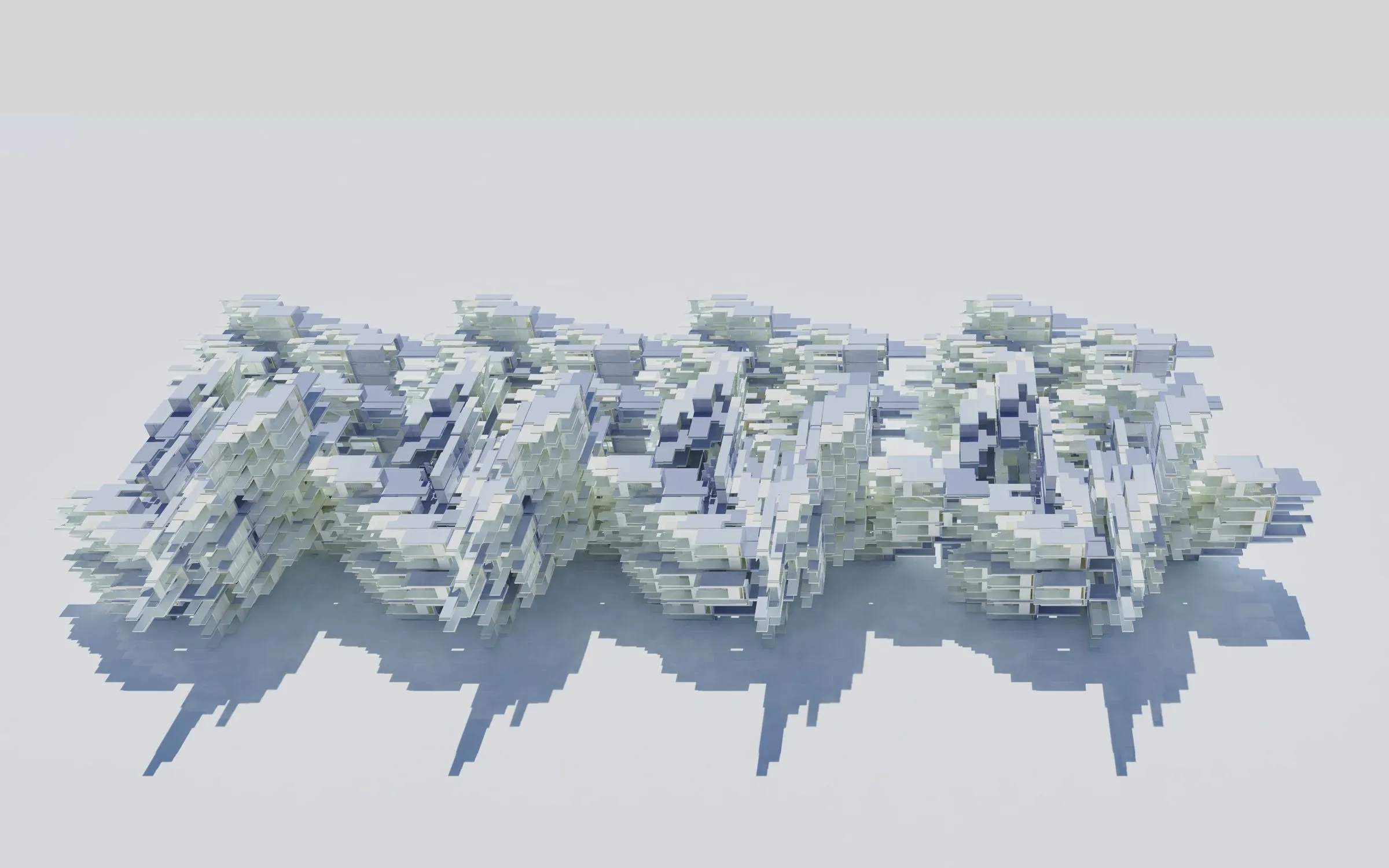 Three low aggregates of parts standing in a row, casting long shadows