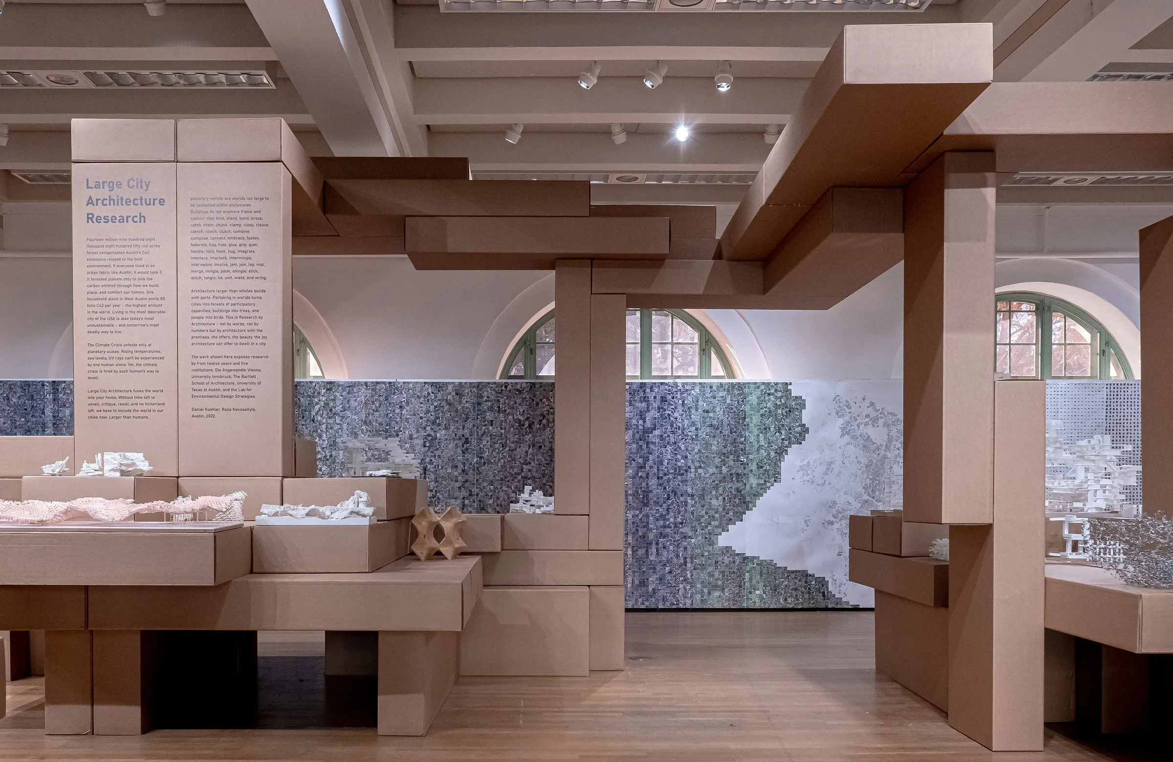 The gallery with its arched windows, plinths and printed wall